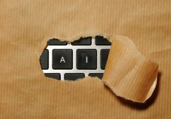 A piece of cardboard with a keyboard appearing through it